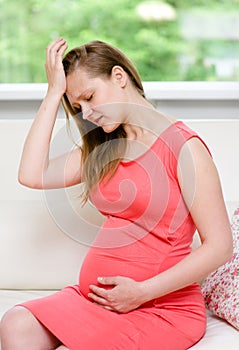 Pregnant woman with strong pain of stomach