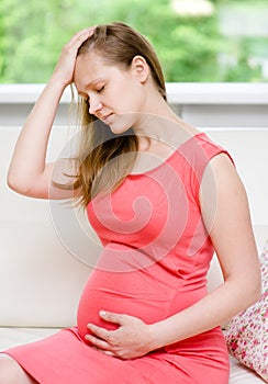 Pregnant woman with strong pain of stomach