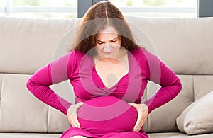 Pregnant woman suffering belly