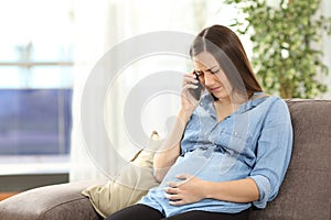 Pregnant woman suffering on the phone