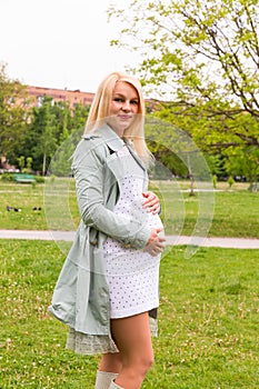 Pregnant woman on a sunny day outdoors