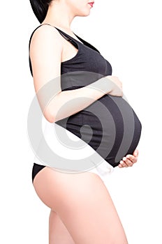 Pregnant woman in the supporting bandage for pregnant