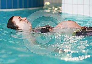 Pregnant woman swimming