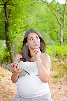 Pregnant woman with Tablet PC