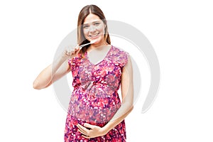 Pregnant woman taking care of her teeth