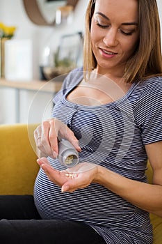 Pregnant Woman Taking Folic Acid Tablets