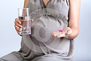 Pregnant woman taking medicines