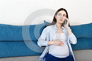 Pregnant woman talking on phone