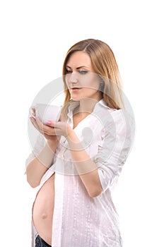 Pregnant woman with tea cup