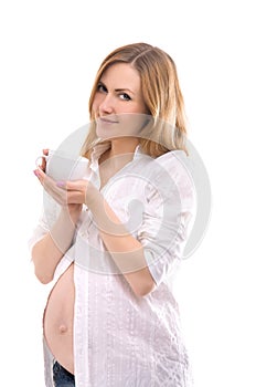 Pregnant woman with tea cup