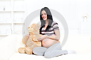 Pregnant woman with Teddy Bear