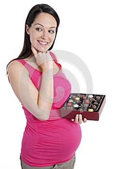 Pregnant woman thinking about chocolates