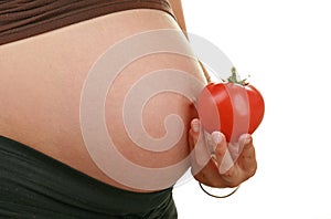 Pregnant woman and tomato