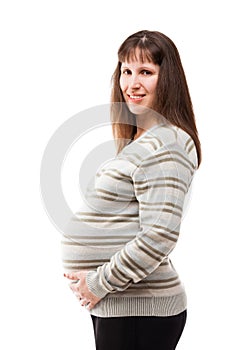 Pregnant woman touching or bonding her abdomen