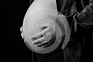 Pregnant woman touching her belly