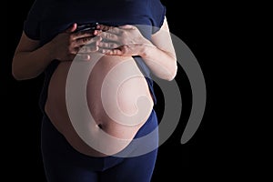 Pregnant woman touching her belly