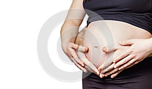 Pregnant woman touching her belly with hands and her husband too