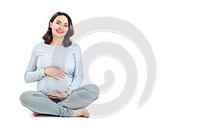 Pregnant woman touching her belly. Healthy pregnancy concept. Pregnant middle aged gravid woman sitting isolated on white