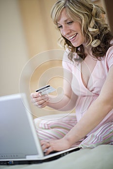 Pregnant woman using credit card