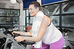 Pregnant woman using exercise bike