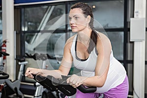 Pregnant woman using exercise bike