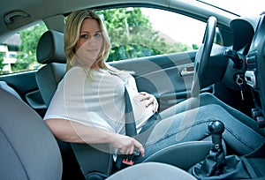 Pregnant woman using safety belt