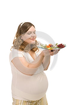 Pregnant woman with vegetables