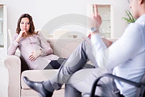 The pregnant woman visiting psychologist doctor