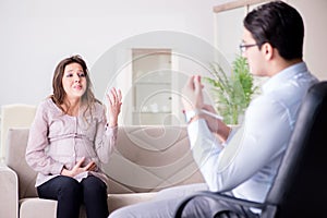 The pregnant woman visiting psychologist doctor