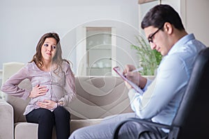 The pregnant woman visiting psychologist doctor