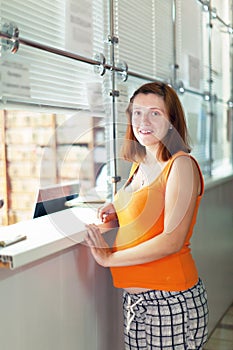 Pregnant woman waiting for patient's records