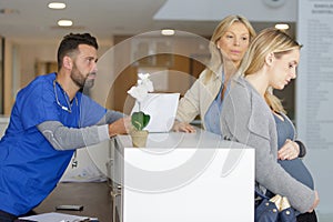 pregnant woman waiting for turn in hospital