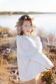 Pregnant woman walking in nature in good weather