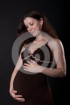 Pregnant woman wearing a brown dress