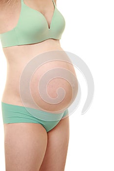 Pregnant woman wearing green pantie