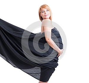 Pregnant woman wearing just a floating black veil