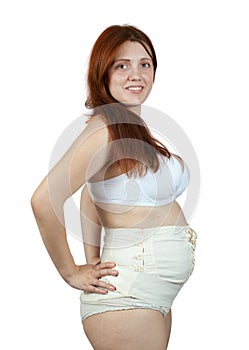 Pregnant woman wearing obstetrical binder photo