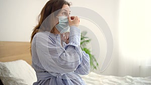 Pregnant woman wears medical mask to protect against a viral infection. Health care during pregnancy