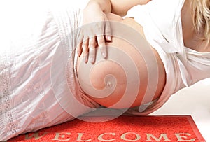 Pregnant woman on the wellcome-carpet photo