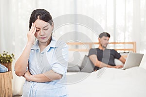 Pregnant woman worried about husband neglect to take care of her health and baby. Wife with ignored workaholic husband using