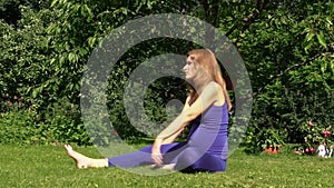Pregnant woman yoga exercise during pregnancy outdoor at park