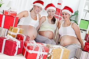 Pregnant women with Christmas gifts