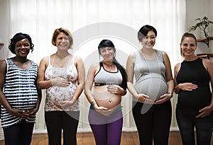 Pregnant women in a class photo