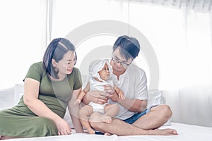 Pregnant women with husband and first daughter having a happy time together. Eight months pregnant women having a happy time with