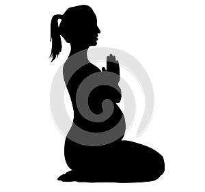 Pregnant women, mother to be trains fitnes sport aerobics, does yoga Pilates. Silhouette