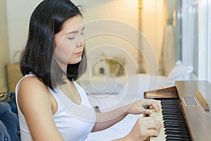 Pregnant women playing the piano