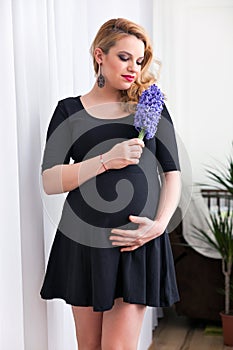 Pregnant young woman standing