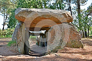 Prehistoric dolmen near megalithic menhirs alignment. Carnac, Brittany. France