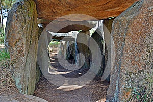 Prehistoric dolmen near megalithic menhirs alignment. Carnac, Brittany. France