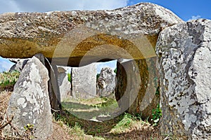 Prehistoric dolmen near megalithic menhirs alignment. Carnac, Brittany. France